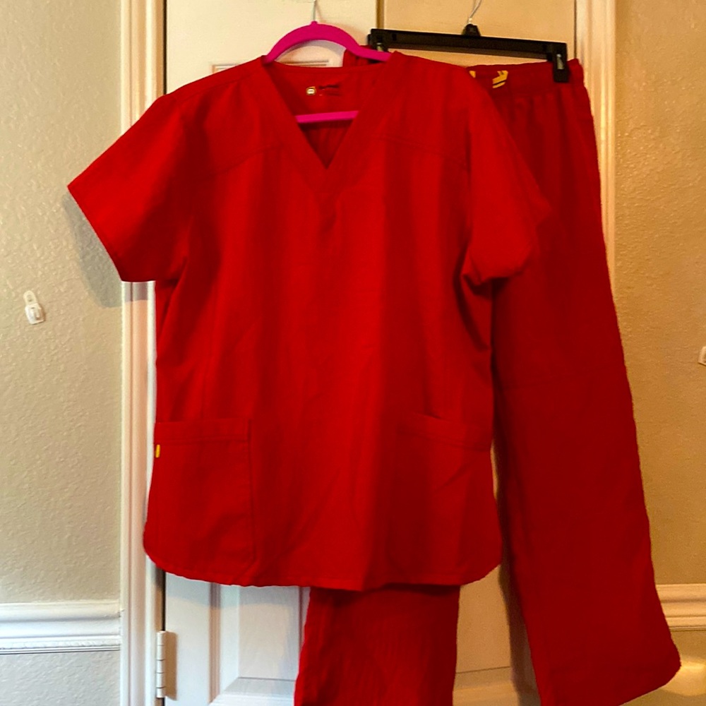 Scrub set red PL pants and XL top good condition. Barely worn like new
